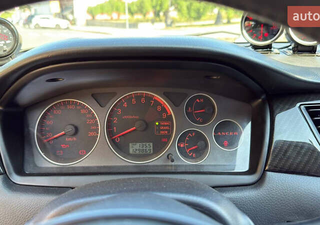 Жовтий Міцубісі Лансер Еволюшн, об'ємом двигуна 2 л та пробігом 124 тис. км за 32000 $, фото 14 на Automoto.ua