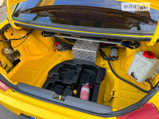Жовтий Міцубісі Лансер Еволюшн, об'ємом двигуна 2 л та пробігом 129 тис. км за 33500 $, фото 16 на Automoto.ua