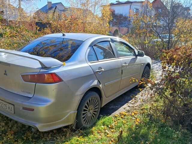 Серый Мицубиси Лансер Эволюшн, объемом двигателя 2 л и пробегом 230 тыс. км за 6600 $, фото 3 на Automoto.ua