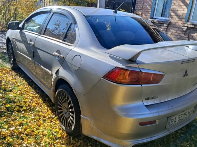 Серый Мицубиси Лансер Эволюшн, объемом двигателя 2 л и пробегом 230 тыс. км за 6600 $, фото 5 на Automoto.ua