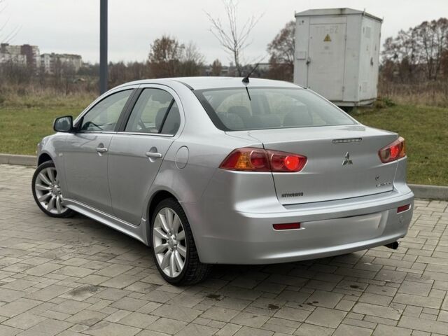 Серый Мицубиси Лансер Эволюшн, объемом двигателя 2 л и пробегом 300 тыс. км за 3500 $, фото 2 на Automoto.ua