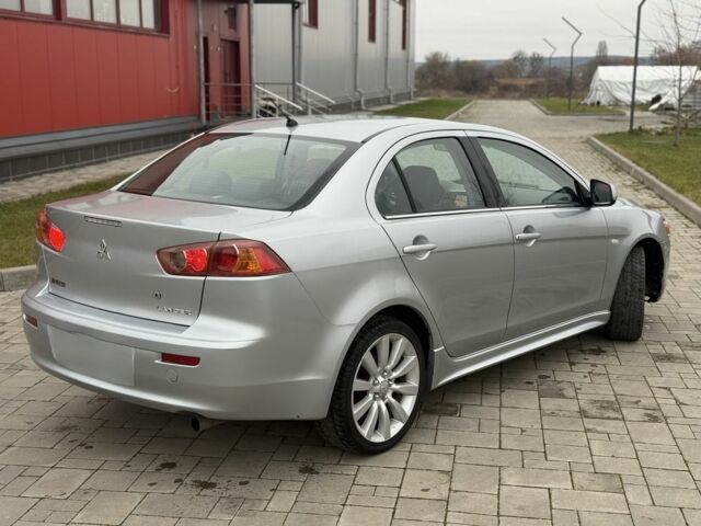 Серый Мицубиси Лансер Эволюшн, объемом двигателя 2 л и пробегом 300 тыс. км за 3500 $, фото 3 на Automoto.ua