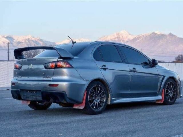 Сірий Міцубісі Лансер Еволюшн, об'ємом двигуна 2 л та пробігом 99 тис. км за 9100 $, фото 4 на Automoto.ua