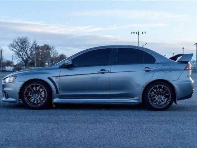 Сірий Міцубісі Лансер Еволюшн, об'ємом двигуна 2 л та пробігом 99 тис. км за 9100 $, фото 7 на Automoto.ua