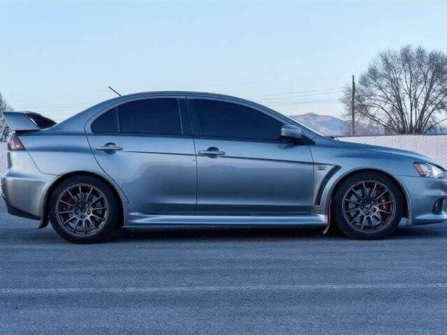 Сірий Міцубісі Лансер Еволюшн, об'ємом двигуна 2 л та пробігом 99 тис. км за 9100 $, фото 3 на Automoto.ua