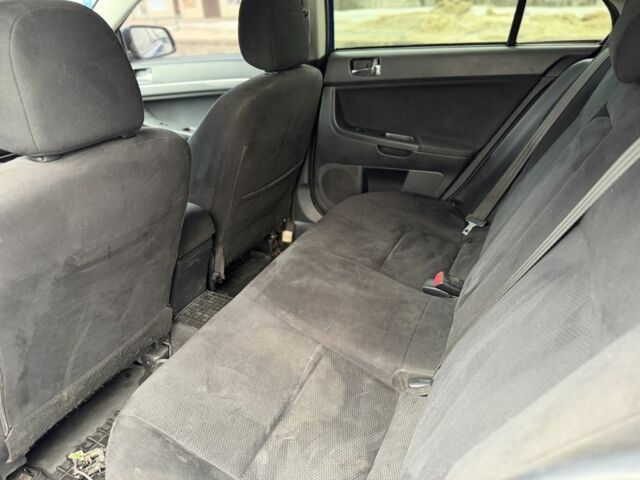 Синій Міцубісі Лансер Еволюшн, об'ємом двигуна 2 л та пробігом 212 тис. км за 8999 $, фото 8 на Automoto.ua