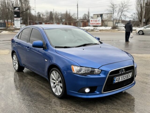 Синій Міцубісі Лансер Еволюшн, об'ємом двигуна 2 л та пробігом 212 тис. км за 8999 $, фото 2 на Automoto.ua