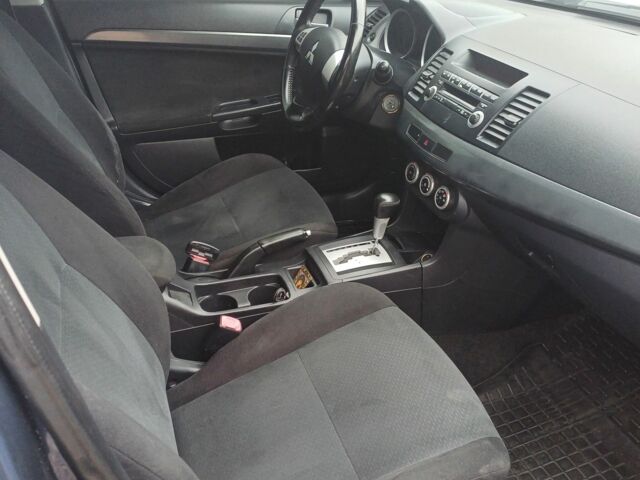 Синий Мицубиси Лансер Эволюшн, объемом двигателя 1.5 л и пробегом 210 тыс. км за 6600 $, фото 5 на Automoto.ua