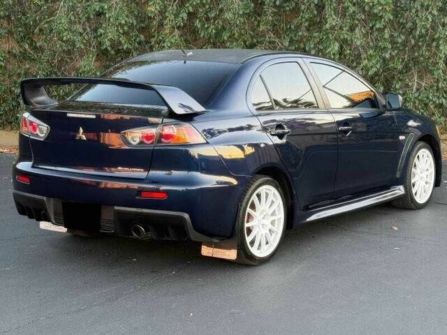 Синий Мицубиси Лансер Эволюшн, объемом двигателя 2 л и пробегом 144 тыс. км за 11000 $, фото 6 на Automoto.ua