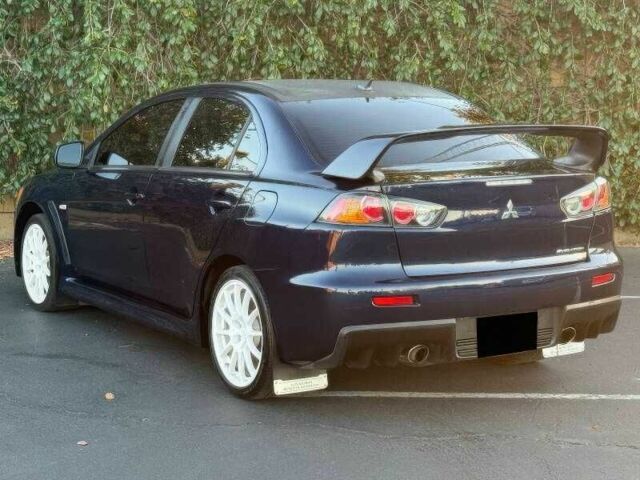 Синий Мицубиси Лансер Эволюшн, объемом двигателя 2 л и пробегом 144 тыс. км за 11000 $, фото 3 на Automoto.ua