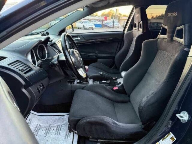 Синий Мицубиси Лансер Эволюшн, объемом двигателя 2 л и пробегом 144 тыс. км за 11000 $, фото 7 на Automoto.ua