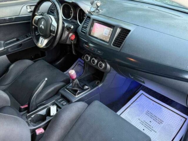 Синий Мицубиси Лансер Эволюшн, объемом двигателя 2 л и пробегом 144 тыс. км за 11000 $, фото 11 на Automoto.ua