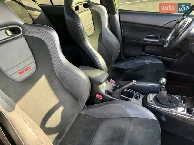 Зеленый Мицубиси Лансер Эволюшн, объемом двигателя 2 л и пробегом 135 тыс. км за 38500 $, фото 23 на Automoto.ua