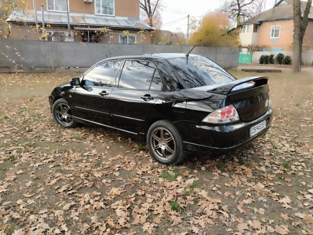 Черный Мицубиси Лансер Спортбэк, объемом двигателя 2 л и пробегом 219 тыс. км за 3999 $, фото 5 на Automoto.ua