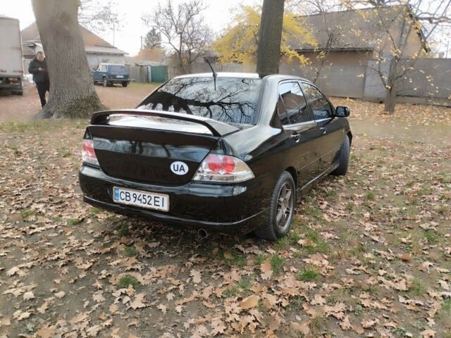 Черный Мицубиси Лансер Спортбэк, объемом двигателя 2 л и пробегом 219 тыс. км за 3999 $, фото 4 на Automoto.ua