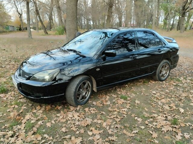 Черный Мицубиси Лансер Спортбэк, объемом двигателя 2 л и пробегом 219 тыс. км за 3999 $, фото 1 на Automoto.ua