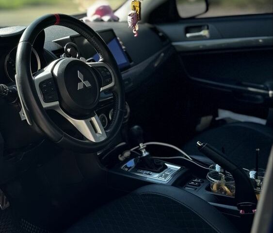 Синій Міцубісі Лансер Спортбек, об'ємом двигуна 2 л та пробігом 185 тис. км за 7499 $, фото 4 на Automoto.ua