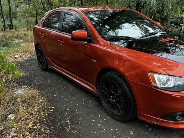 Оранжевый Мицубиси Лансер Спортбэк, объемом двигателя 2 л и пробегом 165 тыс. км за 8000 $, фото 3 на Automoto.ua