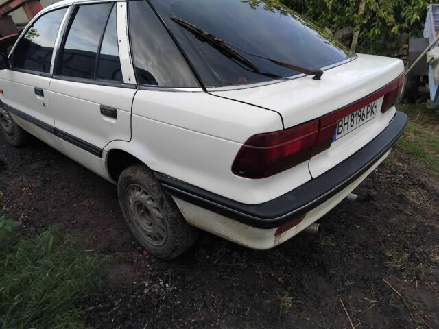 Белый Мицубиси Лансер, объемом двигателя 1.8 л и пробегом 86 тыс. км за 700 $, фото 2 на Automoto.ua