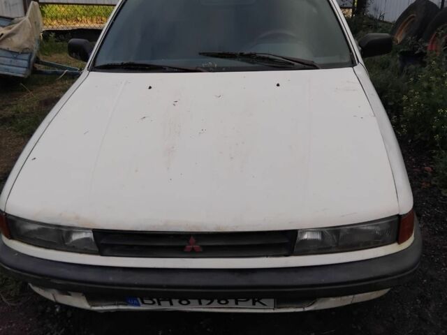 Белый Мицубиси Лансер, объемом двигателя 1.8 л и пробегом 86 тыс. км за 700 $, фото 1 на Automoto.ua