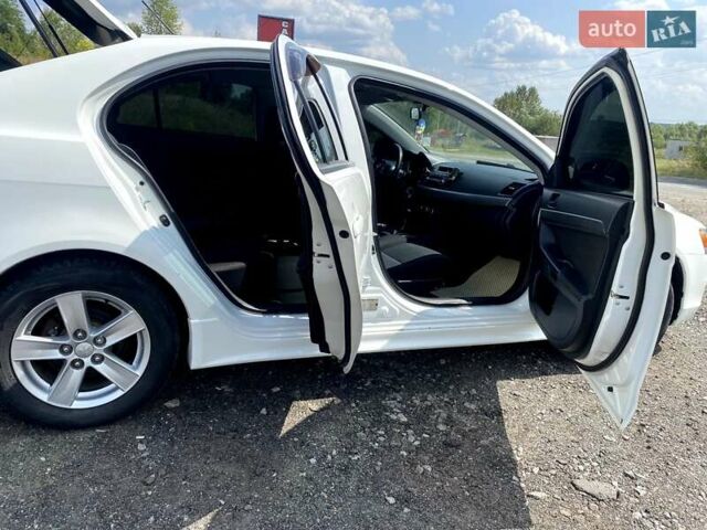 Білий Міцубісі Lancer, об'ємом двигуна 1.8 л та пробігом 238 тис. км за 6000 $, фото 14 на Automoto.ua