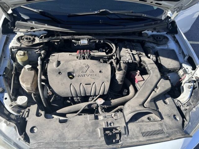 Белый Мицубиси Лансер, объемом двигателя 1.8 л и пробегом 160 тыс. км за 8500 $, фото 7 на Automoto.ua