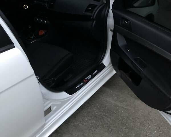 Белый Мицубиси Лансер, объемом двигателя 1.8 л и пробегом 215 тыс. км за 7000 $, фото 8 на Automoto.ua