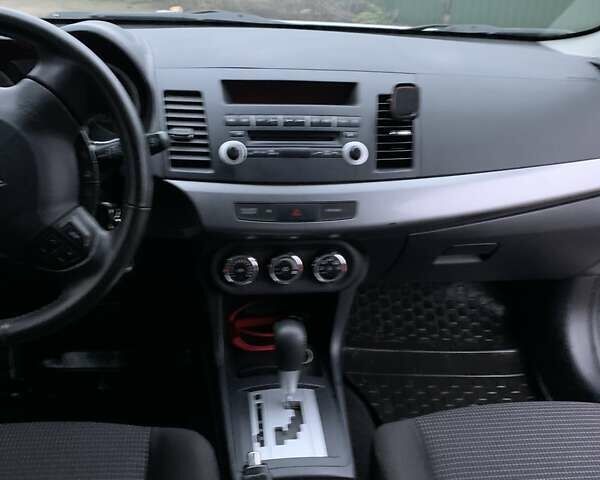 Белый Мицубиси Лансер, объемом двигателя 1.8 л и пробегом 214 тыс. км за 7000 $, фото 15 на Automoto.ua