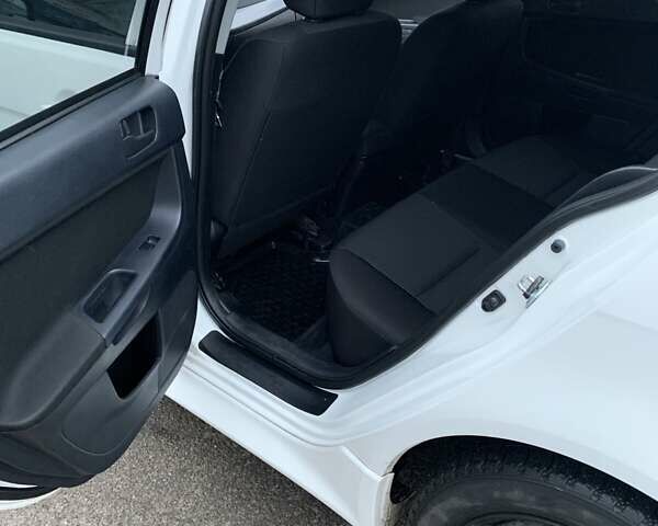 Белый Мицубиси Лансер, объемом двигателя 1.8 л и пробегом 214 тыс. км за 7000 $, фото 14 на Automoto.ua