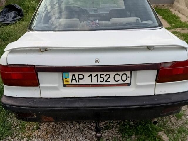 Білий Міцубісі Lancer, об'ємом двигуна 1.5 л та пробігом 100 тис. км за 605 $, фото 2 на Automoto.ua