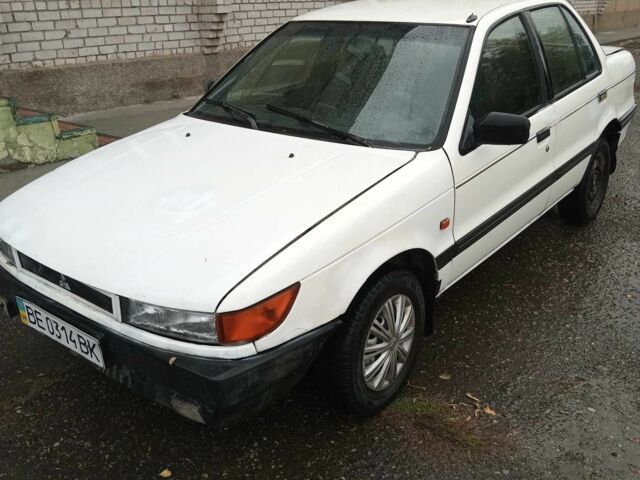 Білий Міцубісі Lancer, об'ємом двигуна 1.3 л та пробігом 345 тис. км за 750 $, фото 5 на Automoto.ua