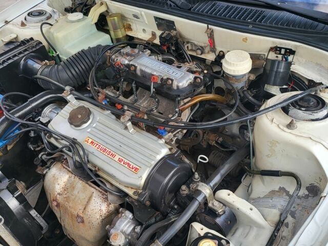 Білий Міцубісі Lancer, об'ємом двигуна 1.3 л та пробігом 280 тис. км за 2750 $, фото 5 на Automoto.ua