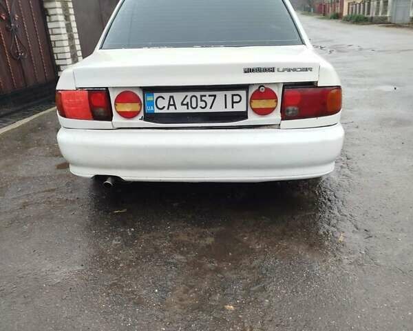 Білий Міцубісі Lancer, об'ємом двигуна 1.3 л та пробігом 300 тис. км за 1700 $, фото 5 на Automoto.ua