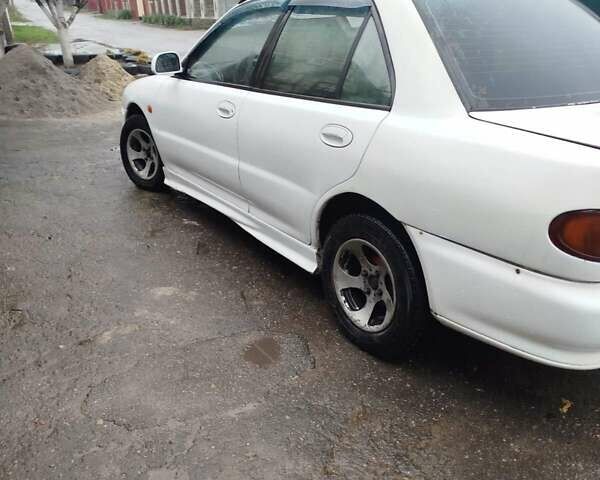 Білий Міцубісі Lancer, об'ємом двигуна 1.3 л та пробігом 300 тис. км за 1700 $, фото 13 на Automoto.ua