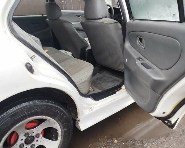 Білий Міцубісі Lancer, об'ємом двигуна 1.3 л та пробігом 300 тис. км за 1700 $, фото 11 на Automoto.ua