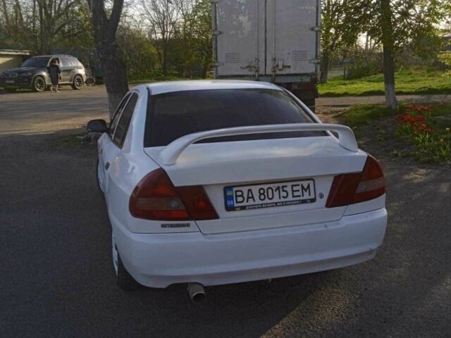 Белый Мицубиси Лансер, объемом двигателя 1.3 л и пробегом 234 тыс. км за 1450 $, фото 7 на Automoto.ua