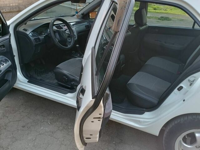 Білий Міцубісі Lancer, об'ємом двигуна 1.6 л та пробігом 198 тис. км за 4463 $, фото 12 на Automoto.ua