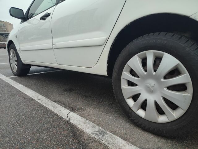 Белый Мицубиси Лансер, объемом двигателя 1.6 л и пробегом 306 тыс. км за 3000 $, фото 7 на Automoto.ua