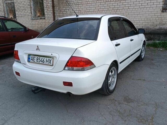 Білий Міцубісі Lancer, об'ємом двигуна 1.6 л та пробігом 198 тис. км за 4463 $, фото 8 на Automoto.ua