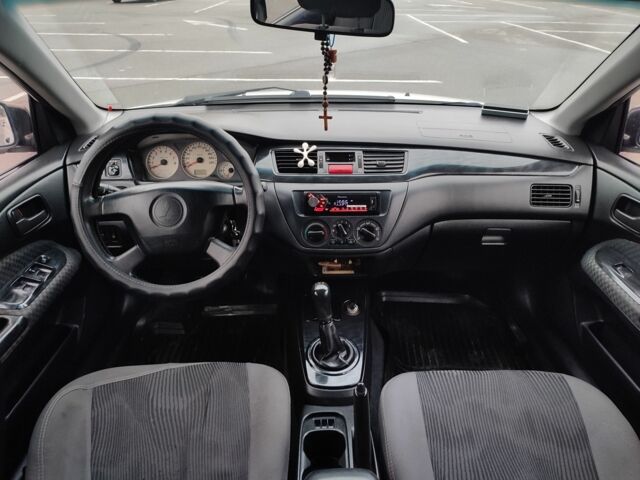 Белый Мицубиси Лансер, объемом двигателя 1.6 л и пробегом 306 тыс. км за 3000 $, фото 12 на Automoto.ua