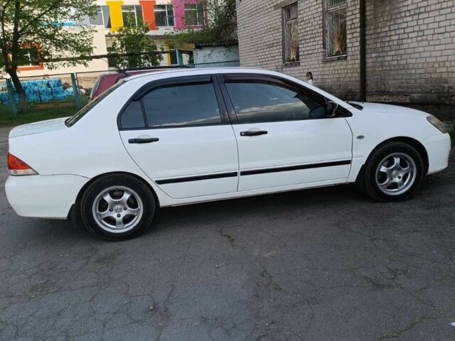 Білий Міцубісі Lancer, об'ємом двигуна 1.6 л та пробігом 198 тис. км за 4463 $, фото 10 на Automoto.ua