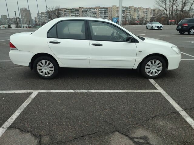 Белый Мицубиси Лансер, объемом двигателя 1.6 л и пробегом 306 тыс. км за 3000 $, фото 1 на Automoto.ua