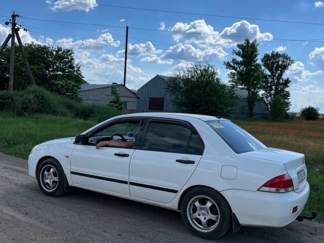 Білий Міцубісі Lancer, об'ємом двигуна 1.6 л та пробігом 198 тис. км за 4463 $, фото 6 на Automoto.ua