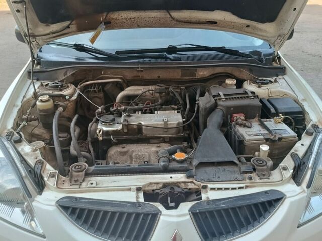 Білий Міцубісі Lancer, об'ємом двигуна 1.6 л та пробігом 198 тис. км за 4463 $, фото 11 на Automoto.ua