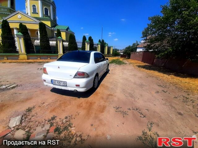 Белый Мицубиси Лансер, объемом двигателя 1.6 л и пробегом 296 тыс. км за 3500 $, фото 2 на Automoto.ua