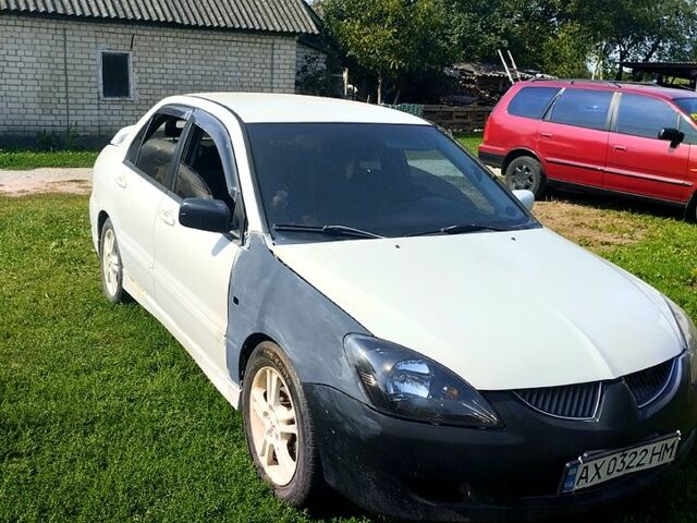 Білий Міцубісі Lancer, об'ємом двигуна 2 л та пробігом 200 тис. км за 1950 $, фото 5 на Automoto.ua
