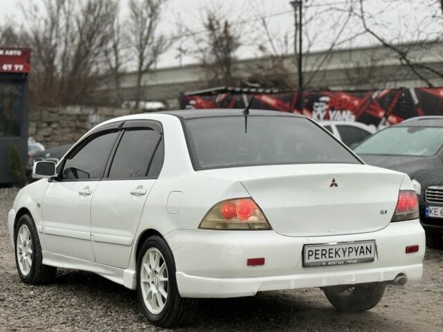 Білий Міцубісі Lancer, об'ємом двигуна 1.6 л та пробігом 301 тис. км за 3300 $, фото 4 на Automoto.ua