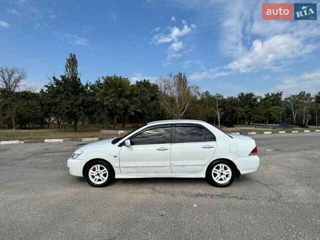 Білий Міцубісі Lancer, об'ємом двигуна 1.6 л та пробігом 339 тис. км за 3999 $, фото 4 на Automoto.ua