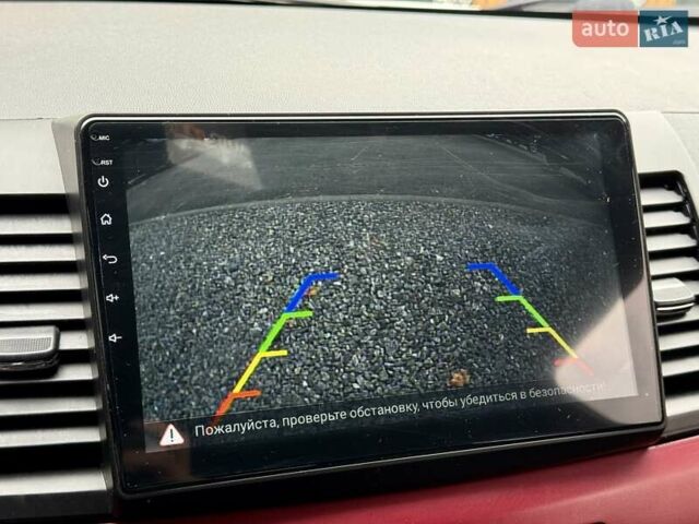 Білий Міцубісі Lancer, об'ємом двигуна 2 л та пробігом 170 тис. км за 6900 $, фото 18 на Automoto.ua