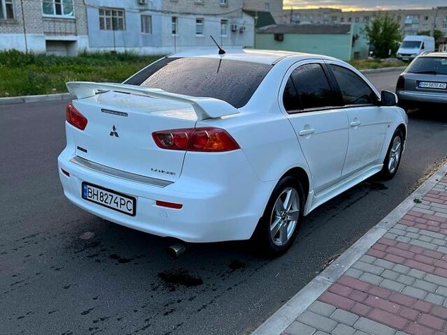 Білий Міцубісі Lancer, об'ємом двигуна 2 л та пробігом 200 тис. км за 7500 $, фото 4 на Automoto.ua